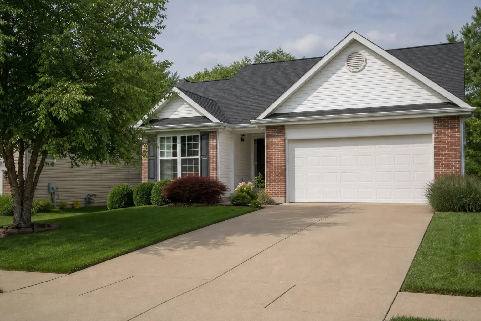 Junk Removal O’Fallon Suburban subdivision driveway for junk removal in O’Fallon, Missouri